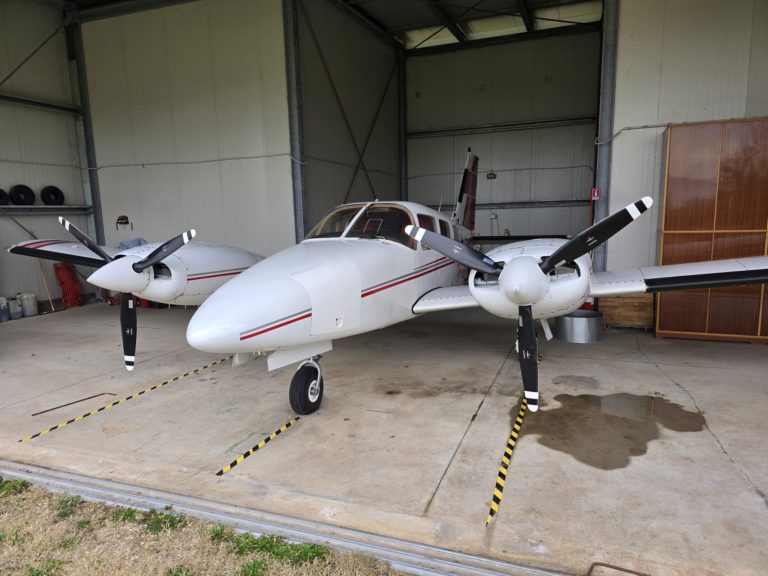 Twin-engine airplane in a hangar