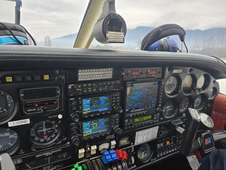 Airplane cockpit with instruments and controls visible.