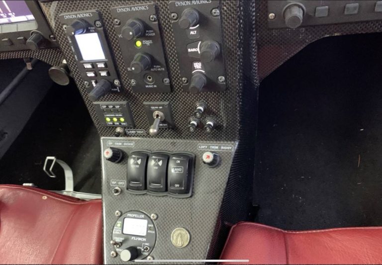 Cockpit control panel with various switches and dials.