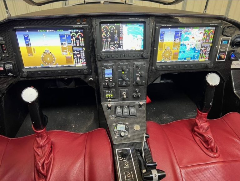 Aircraft cockpit with advanced avionics displays.