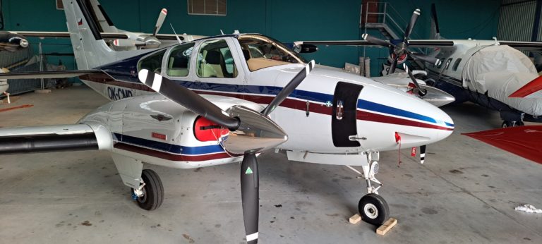 Small aircraft parked in hangar