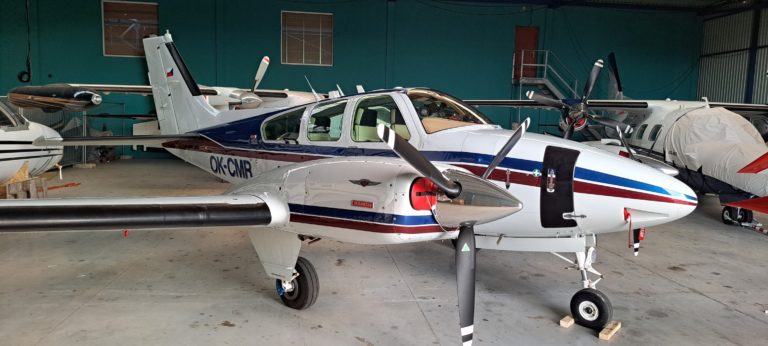 Small propeller aircraft in hangar
