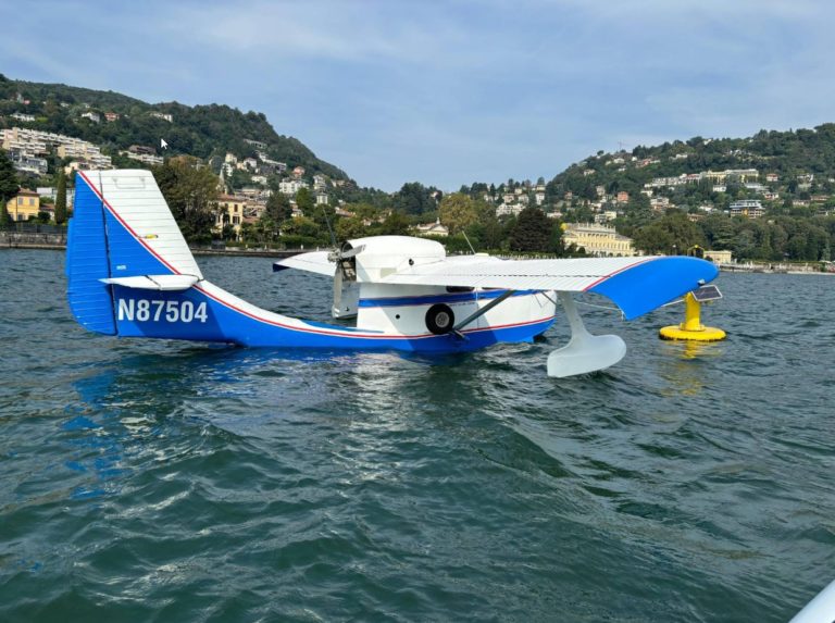 Seaplane on lake with scenic mountain backdrop