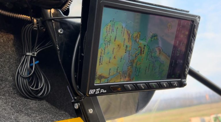 Airplane cockpit with navigation display screen.