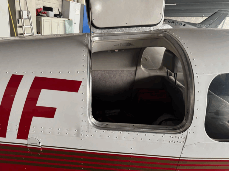 Small aircraft door open for maintenance