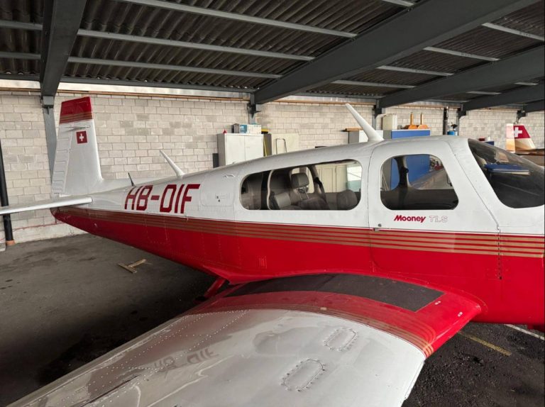 Mooney TLS aircraft parked in hangar