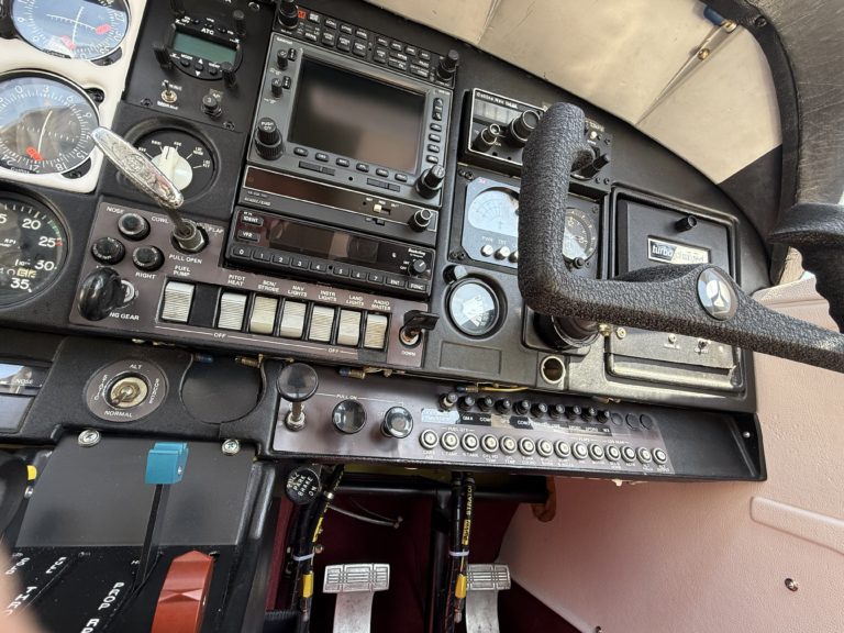 Airplane cockpit controls and instrument panel close-up.