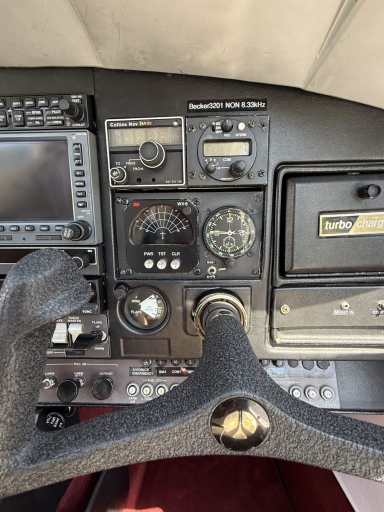 Aircraft cockpit instruments and controls display.
