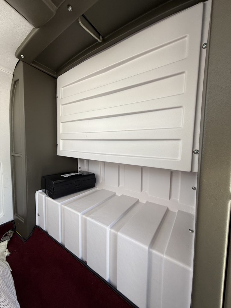 Wall-mounted white panel in interior space