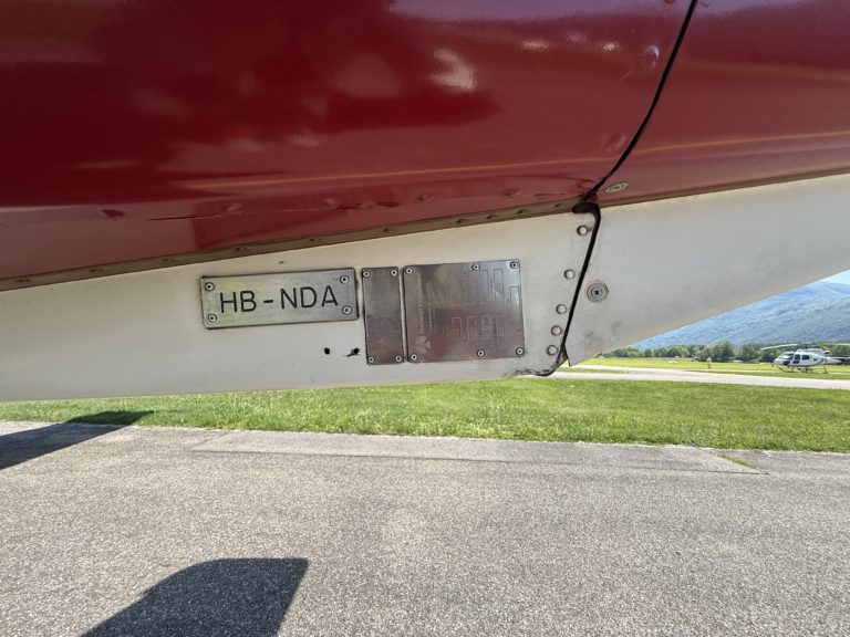 Airplane tail number HB-NDA on runway