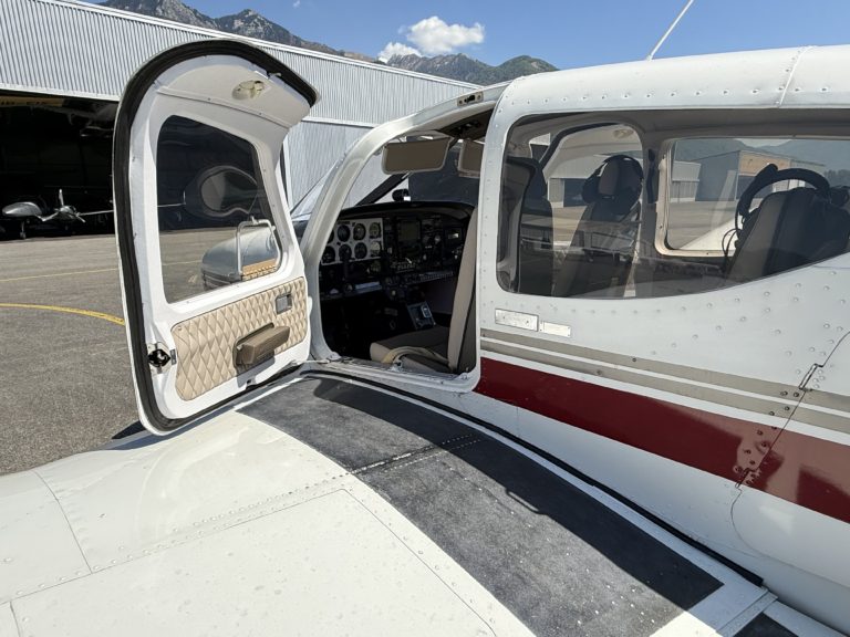 Open door of parked small aircraft