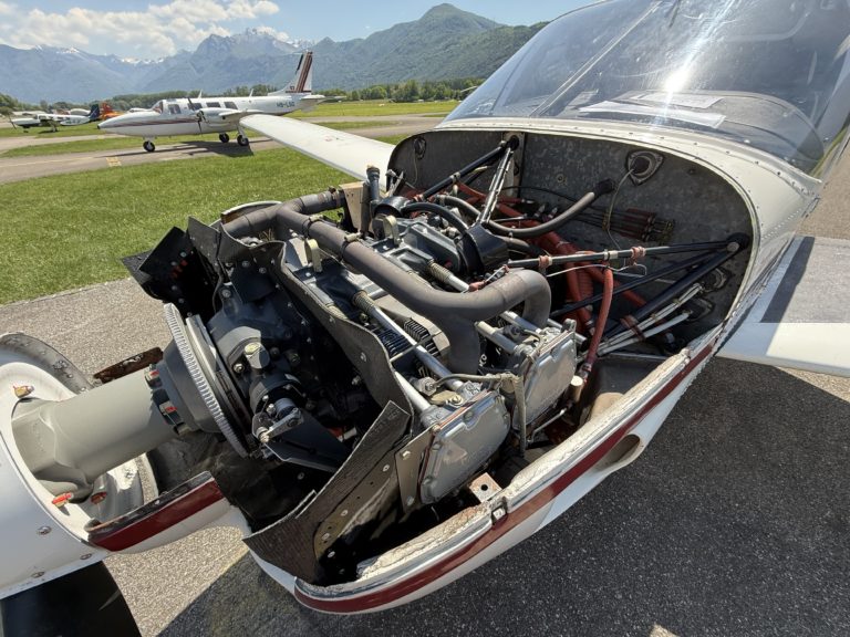 Small aircraft engine exposed on runway