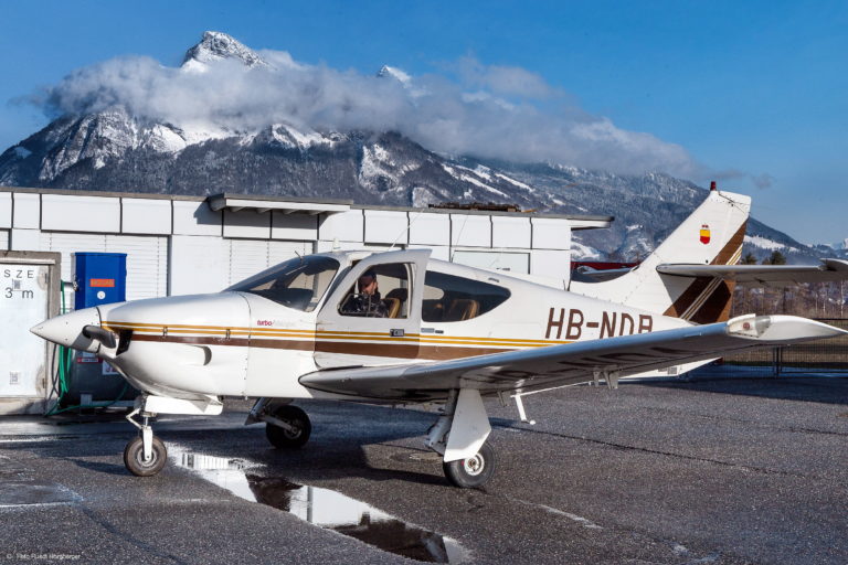 Small plane parked at snowy mountain airport