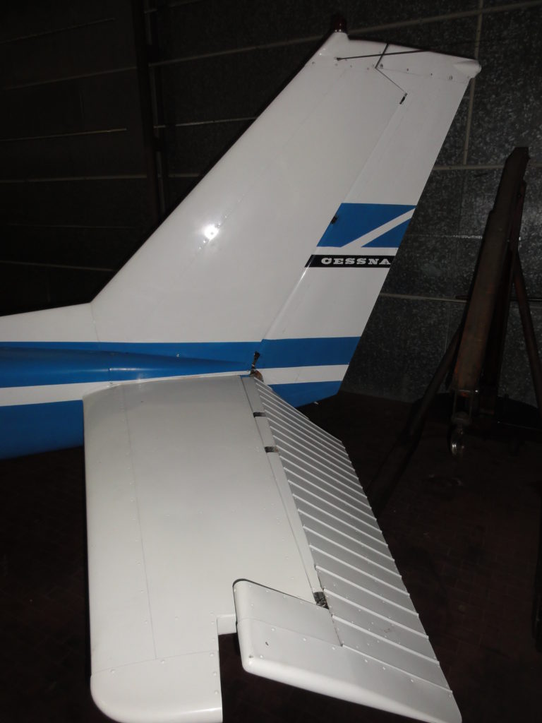 Cessna aircraft tail with blue stripes