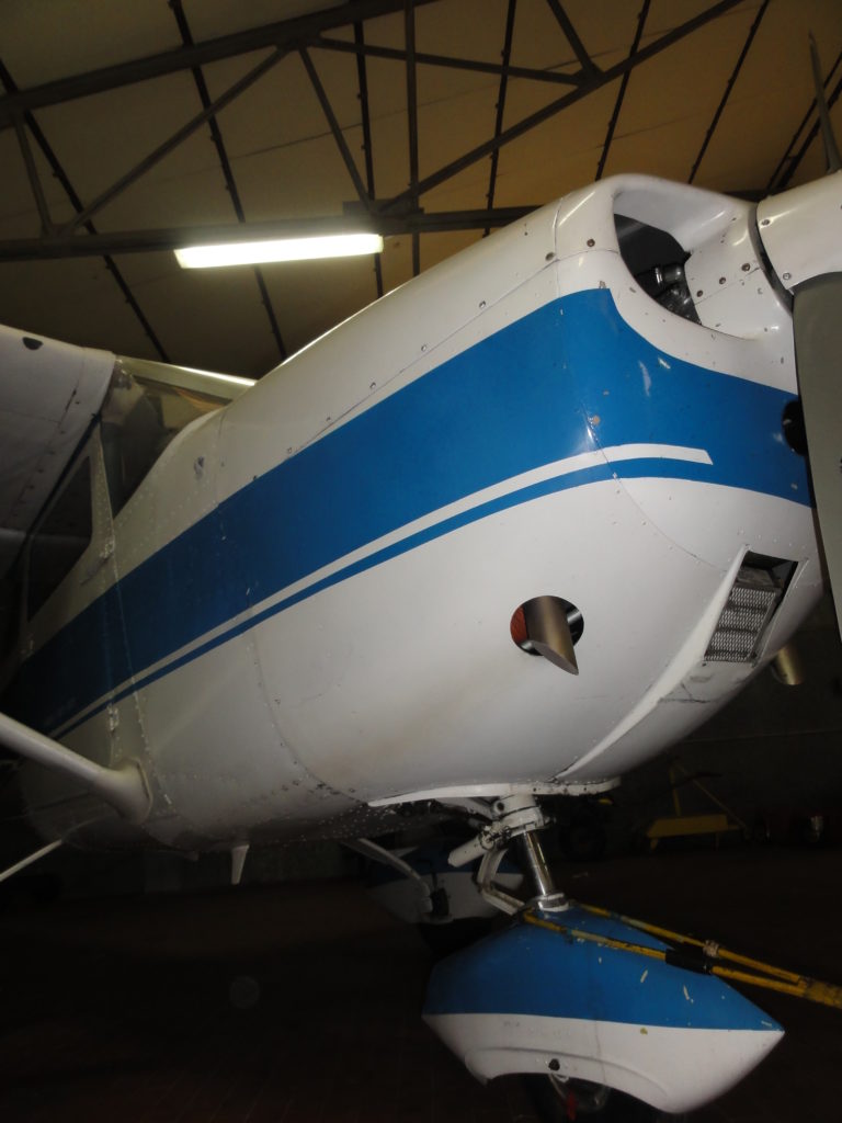 Small aircraft nose in hangar