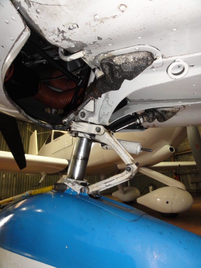 Airplane landing gear in maintenance hangar