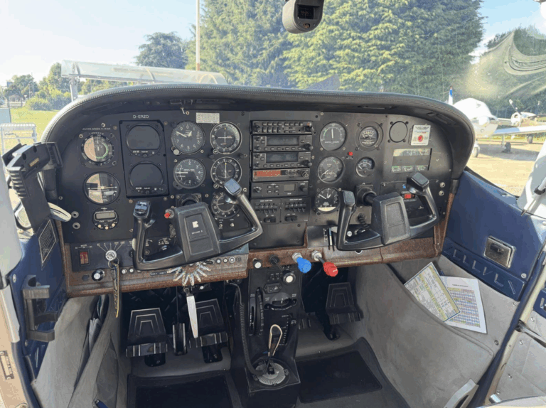 Small aircraft cockpit controls and instruments.