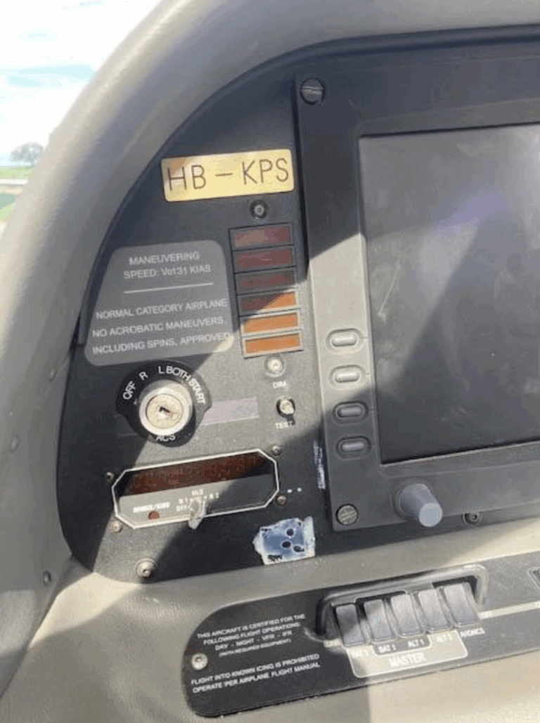 Aircraft cockpit panel with controls and labels.