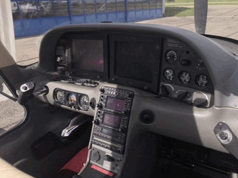 Cockpit of small aircraft with instrument panels.