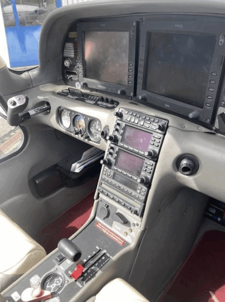 Airplane cockpit with control panels and gauges.