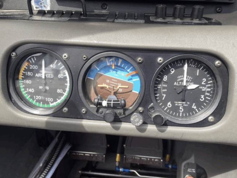 Cockpit instruments: airspeed, altitude, attitude indicators.