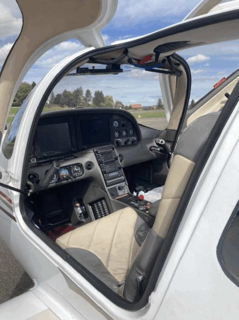 Small aircraft cockpit with open door