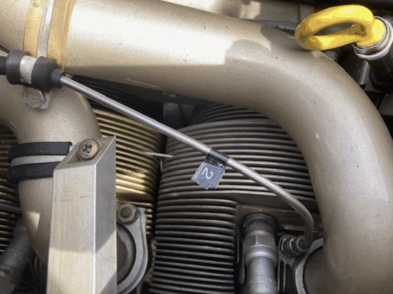 Close-up of engine component with yellow handle