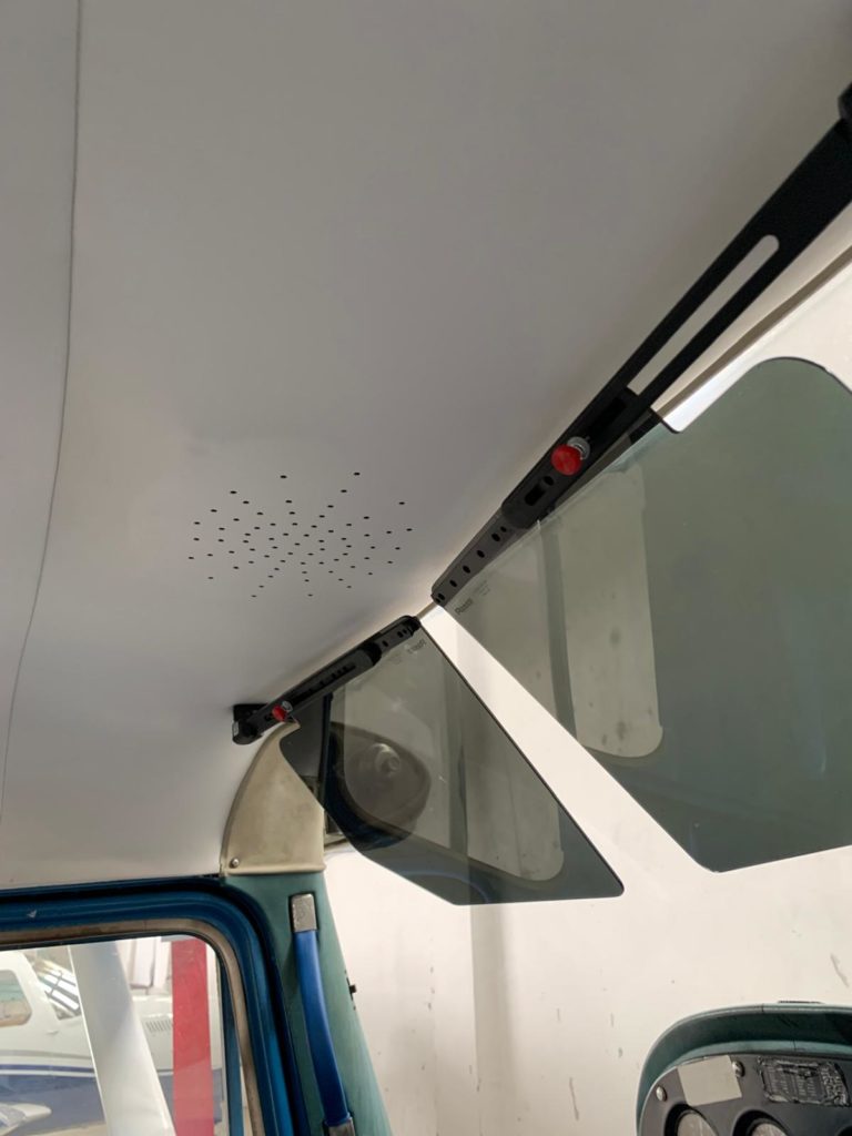 Aircraft cockpit sun visor and ceiling detail.